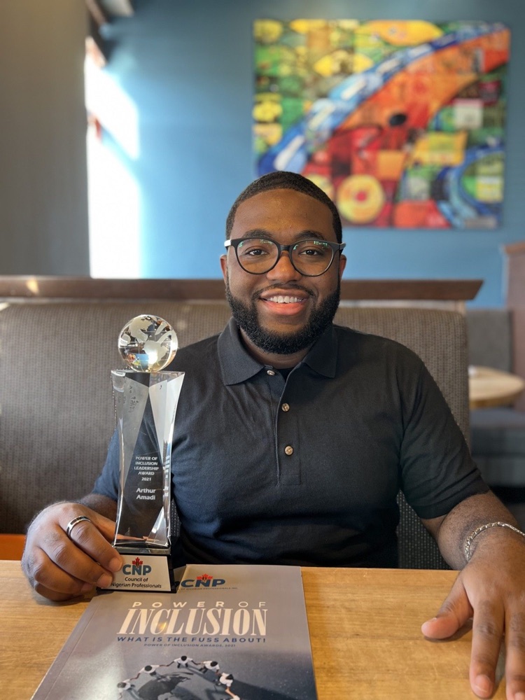 Arthur Amadi with the Power of Inclusion Leadership Award
